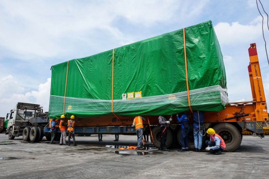 Staff handling a shipment for dispatch